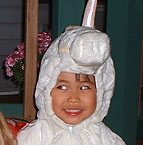 Trick-or-treating as a unicorn/pegasus with her friend Olivia (4� years)