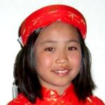 Her latest 'ao dai' dress courtesy of her grandma's visit to Little Saigon (8 years)
