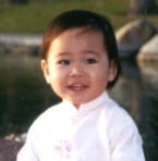 Sangha in an 'ao dai,' the traditional Vietnamese dress (19 months)